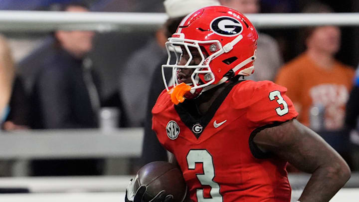Georgia running back Nate Frazier (3) warms up before the start of the SEC championship game against Texas in Atlanta, on Saturday, Dec. 7, 2024.