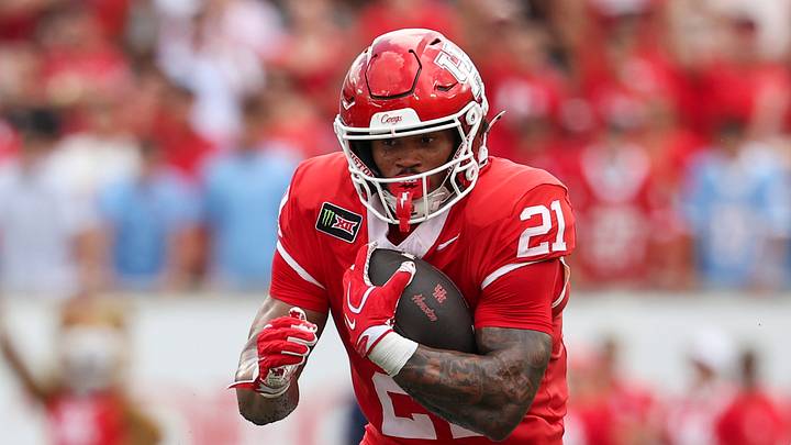 Sep 5, 2026; Houston, Texas, USA; Houston Cougars running back Makhi Hughes (21) runs with the ball during the first quarter against the Oregon State Beavers at TDECU Stadium. Mandatory Credit: Troy Taormina-Imagn Images Sep 5, 2026; Houston, Texas, USA; Houston Cougars running back Makhi Hughes (21) runs with the ball during the first quarter against the Oregon State Beavers at TDECU Stadium. Mandatory Credit: Troy Taormina-Imagn Images