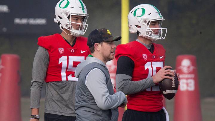 New Oregon offensive coordinator and quarterbacks coach Will Stein, center, works with quarterbacks Marcus Sanders, left, and Austin Novosad at the first practice of spring for Oregon football as they prepare for the 2023 season on Thursday March 16, 2023.

Eug 031623 Uo Spring Fb 05