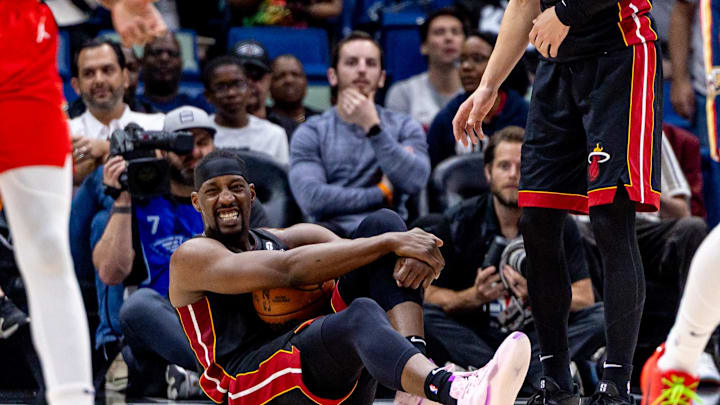 Apr 11, 2025; New Orleans, Louisiana, USA; Miami Heat center Bam Adebayo (13) reacts to landing on the back of the shoe of New Orleans Pelicans center Kylor Kelley (35) during the first half at Smoothie King Center. Mandatory Credit: Stephen Lew-Imagn Images Apr 11, 2025; New Orleans, Louisiana, USA; Miami Heat center Bam Adebayo (13) reacts to landing on the back of the shoe of New Orleans Pelicans center Kylor Kelley (35) during the first half at Smoothie King Center. Mandatory Credit: Stephen Lew-Imagn Images