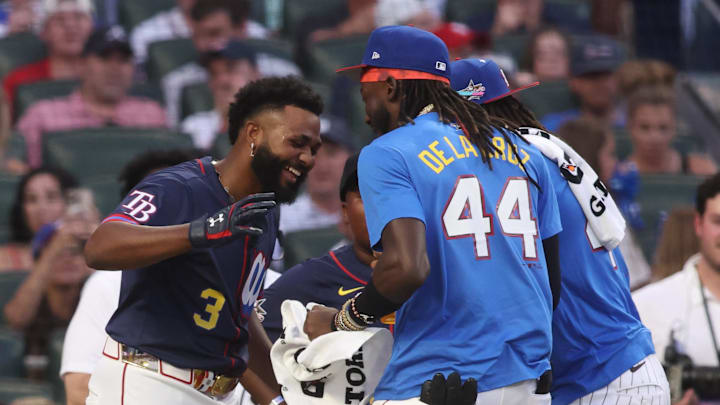 Jul 14, 2025; Atlanta, GA, USA; Tampa Bay Rays infielder Junior Caminero (13) talks with National League shortstop Elly De La Cruz (44) of the Cincinnati Reds during the 2025 Home Run Derby at Truist Park. Mandatory Credit: Brett Davis-Imagn Images