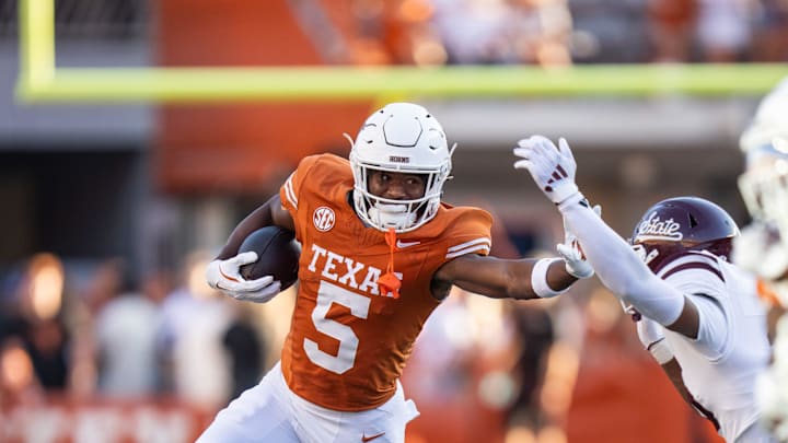 Texas Longhorns wide receiver Ryan Wingo (5) wards off a defender while advancing the ball as the Texas Longhorns take on Mississippi State at Darrell K Royal-Texas Memorial Stadium in Austin Saturday, Sept. 28, 2024. Texas Longhorns wide receiver Ryan Wingo (5) wards off a defender while advancing the ball as the Texas Longhorns take on Mississippi State at Darrell K Royal-Texas Memorial Stadium in Austin Saturday, Sept. 28, 2024.