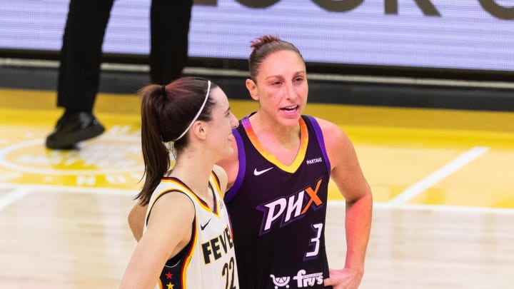 Indiana Fever guard Caitlin Clark (22) and Phoenix Mercury guard Diana Taurasi (3) talk at half court during a free throw on June 30, 2024, at Footprint Center in Phoenix. Indiana Fever guard Caitlin Clark (22) and Phoenix Mercury guard Diana Taurasi (3) talk at half court during a free throw on June 30, 2024, at Footprint Center in Phoenix.