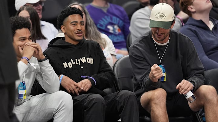 Mar 18, 2025; Charlotte, North Carolina, USA; Carolina Panthers quarterback Bryce Young and friends watch during second half between the Charlotte Hornets and the Atlanta Hawks at Spectrum Center. 