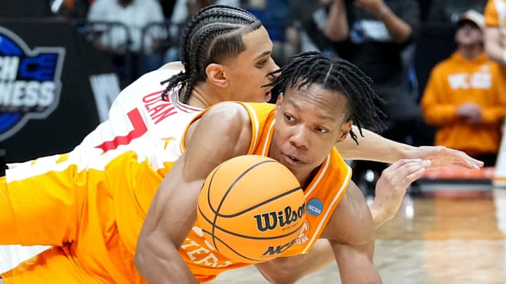 Tennessee Volunteers guard Jordan Gainey (11) and Houston Cougars guard Milos Uzan (7) battle for control of the ball during the second half of a game Sunday, March 30, 2025, during the Elite Eight round of the NCAA March Madness tournament at Lucas Oil Stadium in Indianapolis. Houston defeated Tennessee 69-50.