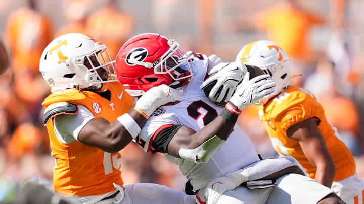 Tennessee linebacker Edwin Spillman (13) tackles Georgia running back Josh McCray (2) during a NCAA football game between Tennessee and Georgia at Neyland Stadium in Knoxville, Tennessee, on September 13, 2025.
