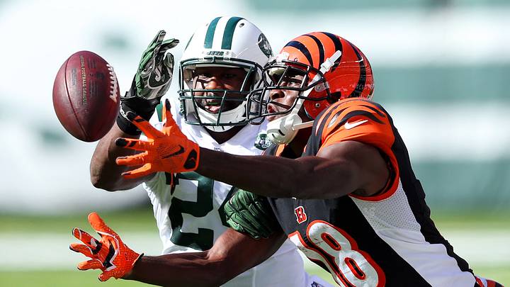 Sep 11, 2016; East Rutherford, NJ, USA; Cincinnati Bengals wide receiver A.J. Green (18) catches a pass in front of New York Jets corner back Darrelle Revis (24) during the fourth quarter at MetLife Stadium. Mandatory Credit: Brad Penner-USA TODAY Sports Sep 11, 2016; East Rutherford, NJ, USA; Cincinnati Bengals wide receiver A.J. Green (18) catches a pass in front of New York Jets corner back Darrelle Revis (24) during the fourth quarter at MetLife Stadium. Mandatory Credit: Brad Penner-USA TODAY Sports