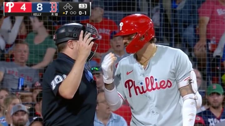 Umpire Derek Thomas listens to Nick Castellanos voice a complaint during Red Sox - Phillies. 