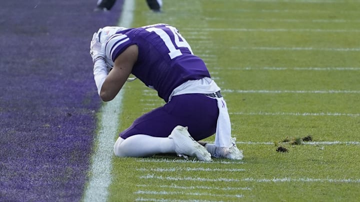 Nov 4, 2023; Chicago, Illinois, USA; Northwestern Wildcats wide receiver Cam Johnson (14) after missing a pass agains the Iowa Hawkeyes during the first half at Wrigley Field. Mandatory Credit: David Banks-Imagn Images