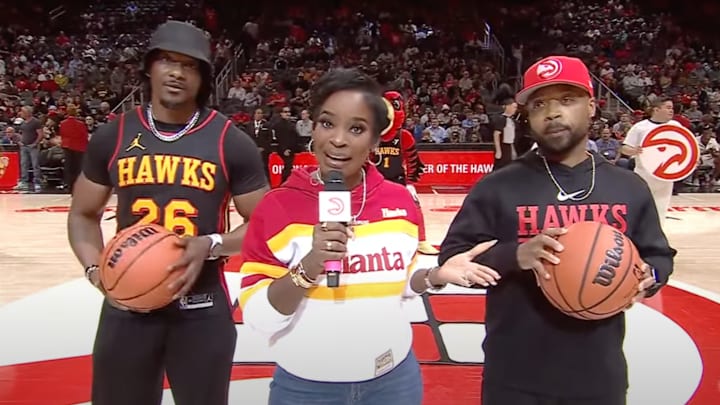 Hawks in-game host Shamea Morton and two fans before a tragic event.
