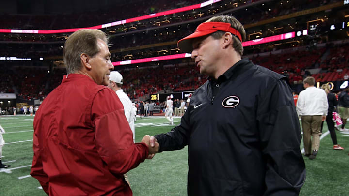 Former Alabama Crimson Tide head coach Nick Saban shakes hands with Georgia Bulldogs head coach Kirby Smart before the 2018 CFP national championship college football game at Mercedes-Benz Stadium. 
