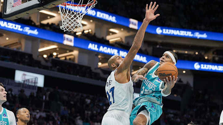 Nov 1, 2025; Charlotte, North Carolina, USA; Charlotte Hornets guard Tre Mann (23) drives to the basket against Minnesota Timberwolves center Rudy Gobert (27) during the second quarter at Spectrum Center. Mandatory Credit: Jim Dedmon-Imagn Images Nov 1, 2025; Charlotte, North Carolina, USA; Charlotte Hornets guard Tre Mann (23) drives to the basket against Minnesota Timberwolves center Rudy Gobert (27) during the second quarter at Spectrum Center. Mandatory Credit: Jim Dedmon-Imagn Images