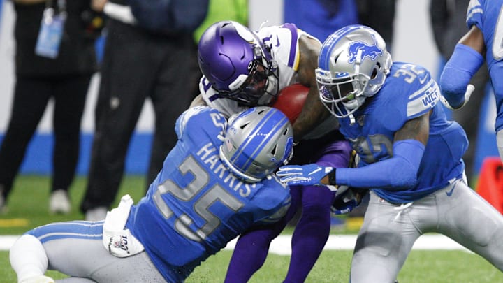 Oct 20, 2019; Detroit, MI, USA; Minnesota Vikings running back Ameer Abdullah (31) gets tackled by Detroit Lions defensive back Will Harris (25) and defensive back Tavon Wilson (32) during the first quarter at Ford Field. Mandatory Credit: Raj Mehta-Imagn Images