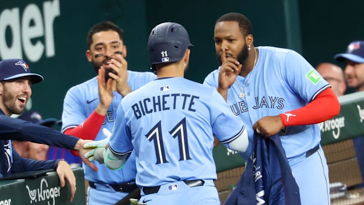 Arlington, Texas, USA; Toronto Blue Jays shortstop Bo Bichette (11) celebrates with Toronto Blue Jays first baseman Vladimir Guerrero Jr. (27) and Toronto Blue Jays right fielder George Springer (4) after hitting a two-run home run during the ninth inning against the Texas Rangers at Globe Life Field. Arlington, Texas, USA; Toronto Blue Jays shortstop Bo Bichette (11) celebrates with Toronto Blue Jays first baseman Vladimir Guerrero Jr. (27) and Toronto Blue Jays right fielder George Springer (4) after hitting a two-run home run during the ninth inning against the Texas Rangers at Globe Life Field.