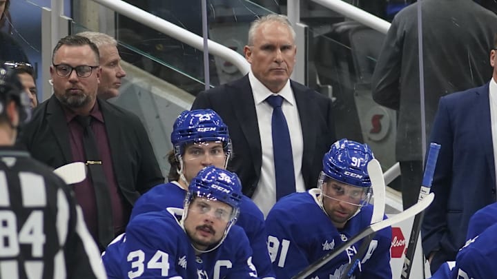 Jan 5, 2025; Toronto, Ontario, CAN; Toronto Maple Leafs head coach Craig Berube (center) during a break in the action against the Philadelphia Flyers at Scotiabank Arena. Mandatory Credit: John E. Sokolowski-Imagn Images