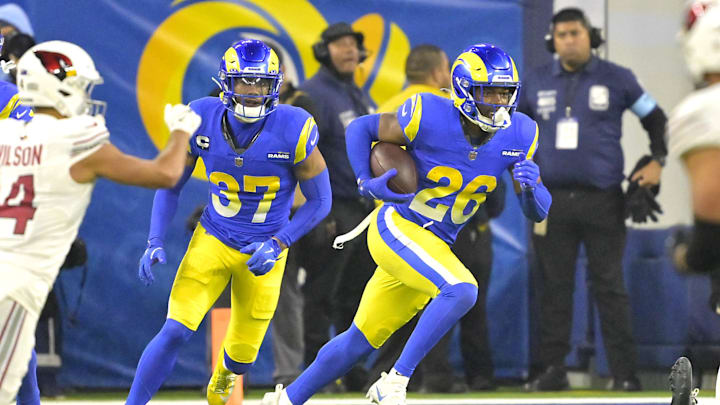 Dec 28, 2024; Inglewood, California, USA;  Los Angeles Rams safety Kamren Kinchens (26) celebrates after an interception in the end zone in the second half against the Arizona Cardinals at SoFi Stadium. Mandatory Credit: Jayne Kamin-Oncea-Imagn Images