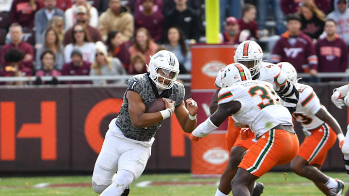 Nov 22, 2025; Blacksburg, Va.; Virginia Tech quarterback Kyron Drones (1) runs the ball against Miami. Nov 22, 2025; Blacksburg, Va.; Virginia Tech quarterback Kyron Drones (1) runs the ball against Miami.