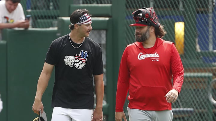 Jul 4, 2024; Pittsburgh, Pennsylvania, USA; Pittsburgh Pirates pitcher Paul Skenes (left) and St. Louis Cardinals pitcher Lance Lynn (right) talk in the outfield before their game at PNC Park. Mandatory Credit: Charles LeClaire-Imagn Images
