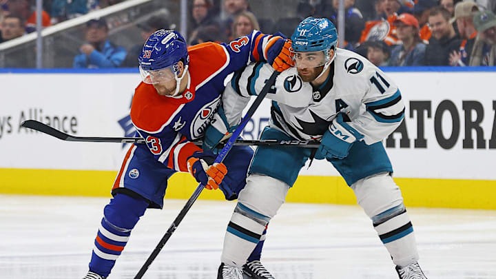Edmonton Oilers forward Victor Arvidsson (33) and San Jose Sharks forward Luke Kunin (11) 