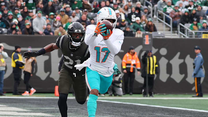 Dec 7, 2025; East Rutherford, New Jersey, USA; Miami Dolphins wide receiver Jaylen Waddle (17) makes a catch for a touchdown against the New York Jets during the first half at MetLife Stadium. Mandatory Credit: Ed Mulholland-Imagn Images