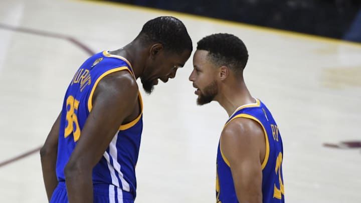 Jun 7, 2017; Cleveland, OH, USA; Golden State Warriors forward Kevin Durant (35, left) celebrates with guard Stephen Curry (30) against the Cleveland Cavaliers during the fourth quarter in game three of the 2017 NBA Finals at Quicken Loans Arena. 