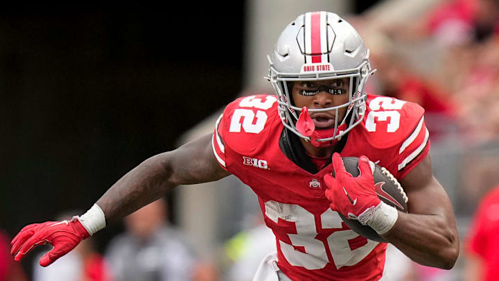 Aug 31, 2024; Columbus, OH, USA; Ohio State Buckeyes running back TreVeyon Henderson (32) runs upfield during the NCAA football game against the Akron Zips at Ohio Stadium. Ohio State won 52-6.