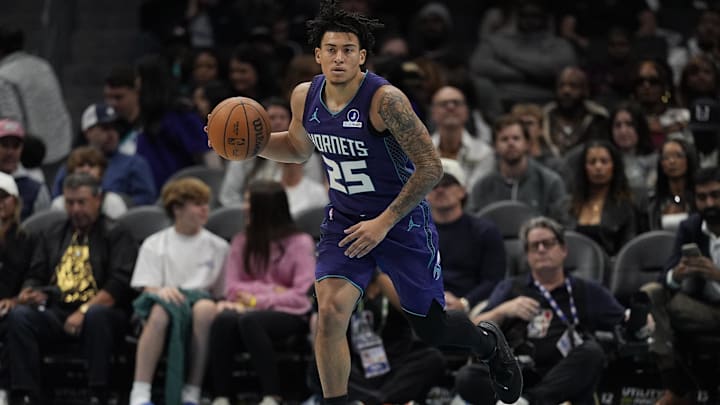 Nov 2, 2025; Charlotte, North Carolina, USA; Charlotte Hornets guard KJ Simpson (25) brings the ball up court against the Utah Jazz during the second quarter at Spectrum Center. Mandatory Credit: Jim Dedmon-Imagn Images