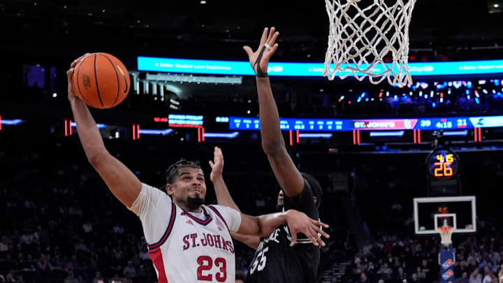 Mar 12, 2026; New York, NY, USA;  St. John's basketball forward Bryce Hopkins (23) shoots past the Providence Friars defense during the first half at Madison Square Garden.