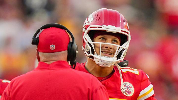 Sep 28, 2025; Kansas City, Missouri, USA; Kansas City Chiefs quarterback Patrick Mahomes (15) talks with head coach Andy Reid during the second half against the Baltimore Ravens at GEHA Field at Arrowhead Stadium. Mandatory Credit: Jay Biggerstaff-Imagn Images