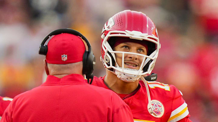 Sep 28, 2025; Kansas City, Missouri, USA; Kansas City Chiefs quarterback Patrick Mahomes (15) talks with head coach Andy Reid during the second half against the Baltimore Ravens at GEHA Field at Arrowhead Stadium. Mandatory Credit: Jay Biggerstaff-Imagn Images