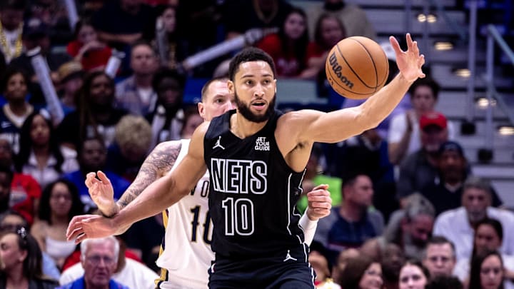 Nov 11, 2024; New Orleans, Louisiana, USA;  Brooklyn Nets guard Ben Simmons (10) is guarded by New Orleans Pelicans center Daniel Theis (10) on a pass during the second half at Smoothie King Center. Mandatory Credit: Stephen Lew-Imagn Images