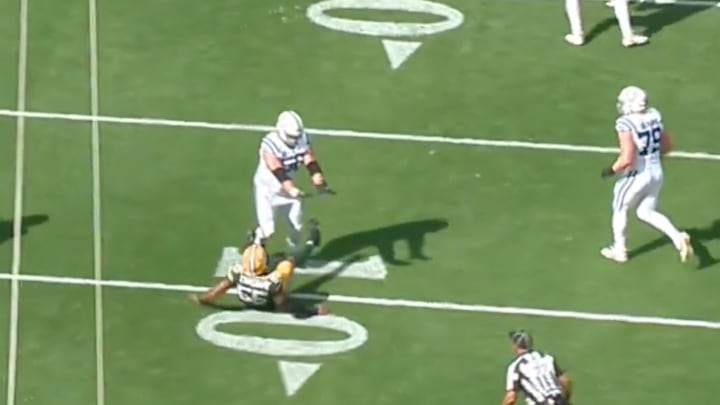 Indianapolis Colts lineman Quenton Nelson stands over a vanquished opponent.