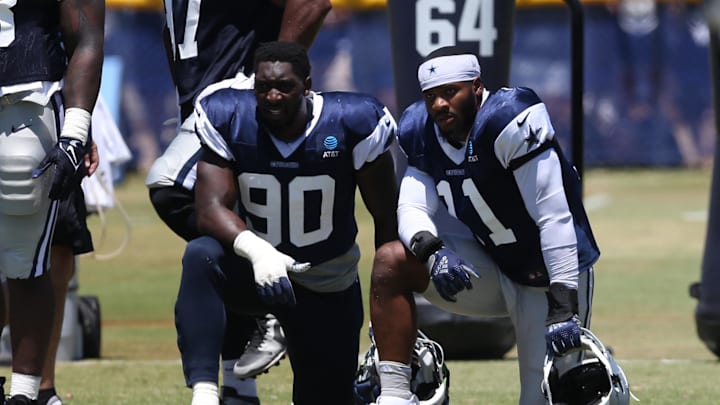 Jul 30, 2024; Oxnard, CA, USA; Dallas Cowboys defensive end DeMarcus Lawrence (90) and linebacker Micah Parsons (11) during training camp at the River Ridge Playing Fields in Oxnard, California. Mandatory Credit: Jason Parkhurst-Imagn Images