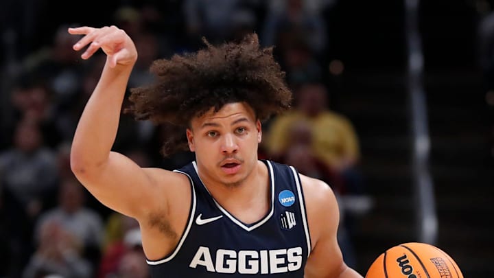 Utah State Aggies guard Javon Jackson (22) drives to the basket during NCAA Men’s Basketball Tournament game against the Purdue Boilermakers, Sunday, March 24, 2024, at Gainbridge Fieldhouse in Indianapolis.