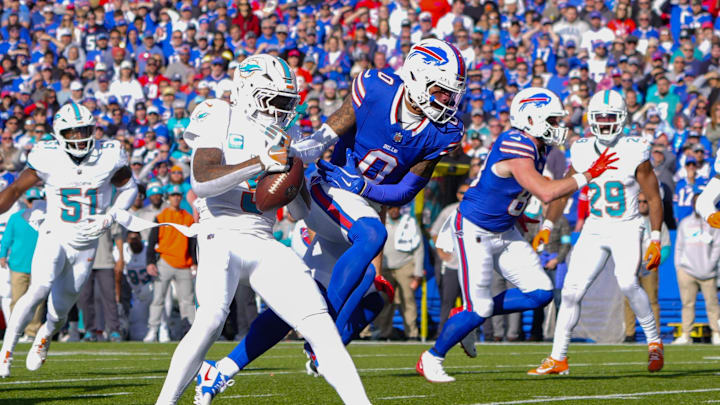 Nov 3, 2024; Orchard Park, New York, USA; Miami Dolphins cornerback Jalen Ramsey (5) takes the ball away from Buffalo Bills wide receiver Keon Coleman (0) and intercepts the pass during the first half at Highmark Stadium. Mandatory Credit: Gregory Fisher-Imagn Images Nov 3, 2024; Orchard Park, New York, USA; Miami Dolphins cornerback Jalen Ramsey (5) takes the ball away from Buffalo Bills wide receiver Keon Coleman (0) and intercepts the pass during the first half at Highmark Stadium. Mandatory Credit: Gregory Fisher-Imagn Images