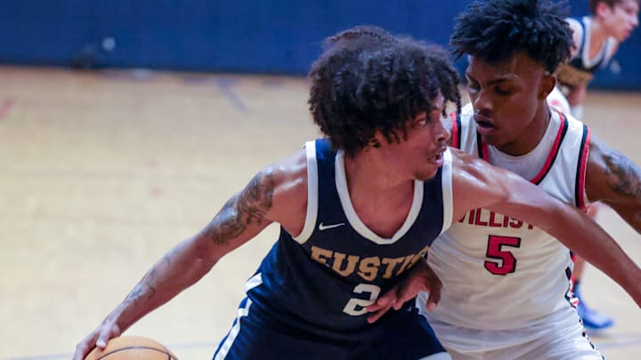 Eustis's Lomar Sparrow (2) drives on Williston De'Andre Harvey (5) in the Kingdom of the Sun Basketball Tournament last December. Last week, he had 16 points, two rebounds, and two assists in a 65-50 loss to St. Petersburg Gibbs in the Class 4A state semifinals.