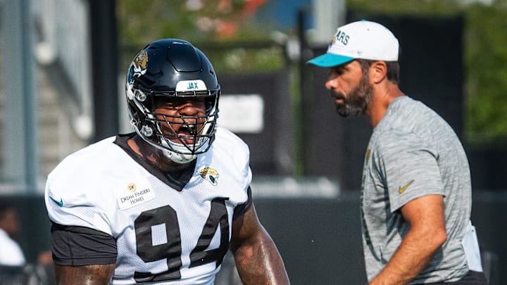 Jacksonville Jaguars defensive tackle Maason Smith (94) runs through tackling drills during the seventh organized team activity at the Miller Electric Center in Jacksonville, Fla. Monday, June 2, 2025. [Doug Engle/Florida Times-Union]