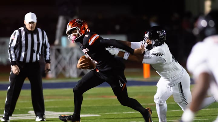 Harrisburg's Messiah Mickens sacks Central York quarterback Brooklyn Nace during the PIAA District 3 Class 6A Championship at Cedar Cliff High School on Friday, Nov. 21, 2025, in New Cumberland.