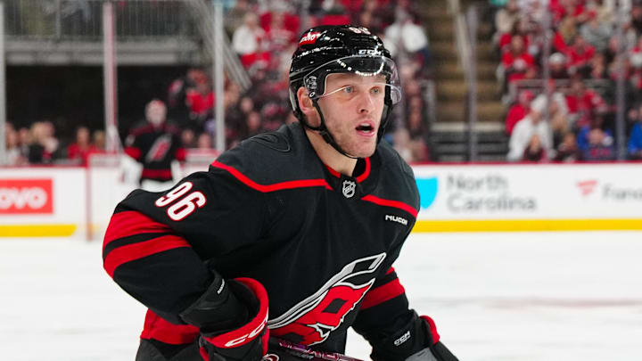 Mar 1, 2025; Raleigh, North Carolina, USA;  Carolina Hurricanes right wing Mikko Rantanen (96) watches his  shot against the Edmonton Oilers during the third period at Lenovo Center. Mandatory Credit: James Guillory-Imagn Images