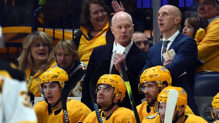 Jan 7, 2020; Nashville, Tennessee, USA; Nashville Predators head coach John Hynes talks with assistant coach Dan Muse during the first period against the Boston Bruins at Bridgestone Arena. Mandatory Credit: Christopher Hanewinckel-Imagn Images