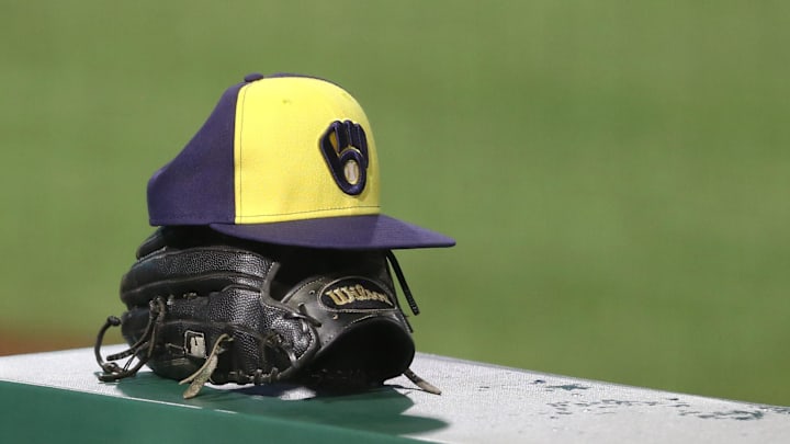 Jul 27, 2020; Pittsburgh, Pennsylvania, USA; A Milwaukee Brewers hat and glove on the dugout rail against the Pittsburgh Pirates during the tenth inning at PNC Park.Milwaukee won 6-5 in eleven innings. Mandatory Credit: Charles LeClaire-Imagn Images Jul 27, 2020; Pittsburgh, Pennsylvania, USA; A Milwaukee Brewers hat and glove on the dugout rail against the Pittsburgh Pirates during the tenth inning at PNC Park.Milwaukee won 6-5 in eleven innings. Mandatory Credit: Charles LeClaire-Imagn Images