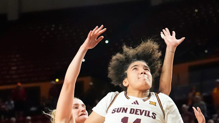Arizona State Sun Devils forward Heloisa Carrera (14) looks to the basket against Utah Utes guard Maty Wilke (23) at Desert Financial Arena on Feb. 11, 2026, in Tempe.