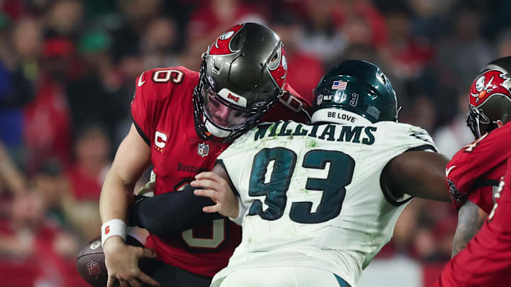 Philadelphia Eagles defensive tackle Milton Williams (93) tackles Tampa Bay Buccaneers quarterback Baker Mayfield (6) 