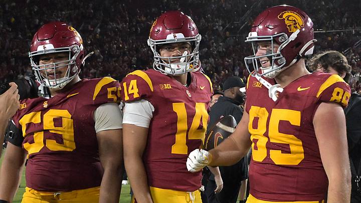 Oct 11, 2025; Los Angeles, California, USA; USC Trojans offensive lineman Micah Banuelos (59), quarterback Jayden Maiava (14) and USC Trojans defensive end Jadyn Ramos (95) celebrate after defeating the Michigan Wolverines at United Airlines Field at the Los Angeles Memorial Coliseum. Mandatory Credit: Jayne Kamin-Oncea-Imagn Images Oct 11, 2025; Los Angeles, California, USA; USC Trojans offensive lineman Micah Banuelos (59), quarterback Jayden Maiava (14) and USC Trojans defensive end Jadyn Ramos (95) celebrate after defeating the Michigan Wolverines at United Airlines Field at the Los Angeles Memorial Coliseum. Mandatory Credit: Jayne Kamin-Oncea-Imagn Images