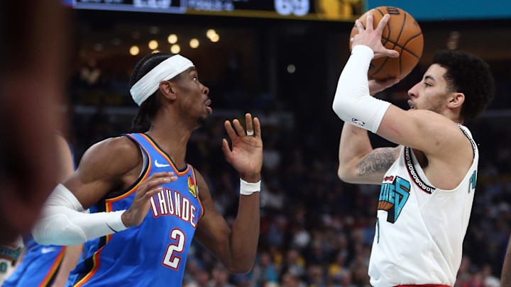 Apr 24, 2025; Memphis, Tennessee, USA; Memphis Grizzlies guard Scotty Pippen Jr. (1) drives to the basket as Oklahoma City Thunder guard Shai Gilgeous-Alexander (2) defends during the second quarter during game three for the first round of the 2024 NBA Playoffs at FedExForum. Mandatory Credit: Petre Thomas-Imagn Images