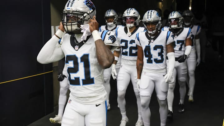 Aug 16, 2025; Houston, Texas, USA; Carolina Panthers safety Nick Scott (21) and teammates get set to run on the field before playing against the Houston Texans at NRG Stadium. 