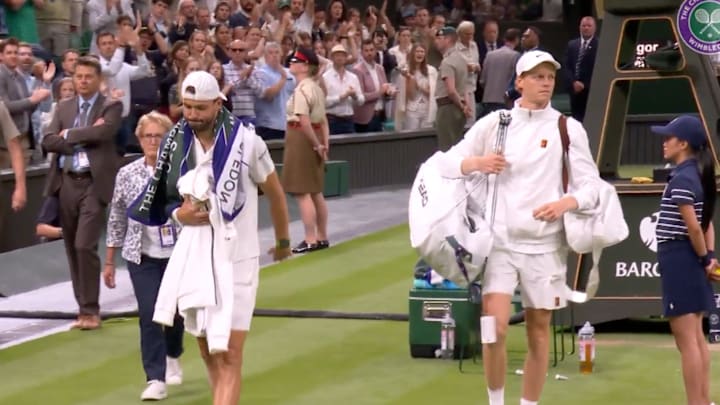 Sinner helped Dimitrov carry his bags off the court after suffering a match-ending injury