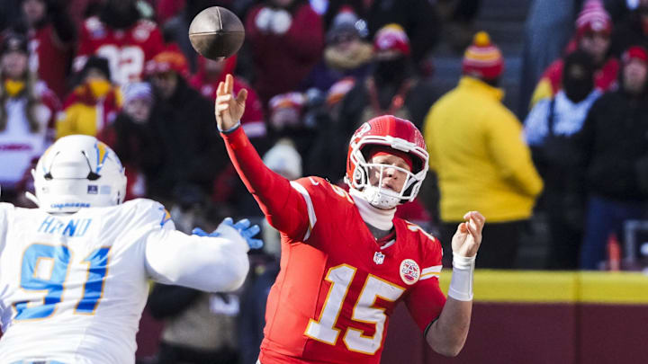 Dec 14, 2025; Kansas City, Missouri, USA; Kansas City Chiefs quarterback Patrick Mahomes (15) passes against the Los Angeles Chargers during the second quarter at GEHA Field at Arrowhead Stadium. Mandatory Credit: Denny Medley-Imagn Images