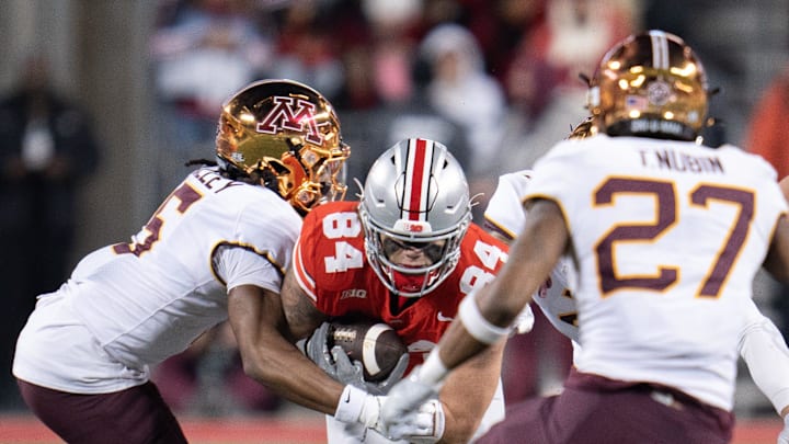 Nov 18, 2023; Columbus, Ohio, USA; 
Ohio State Buckeyes tight end Joe Royer (84) attempts to run past Minnesota Golden Gophers defensive back Justin Walley (5) during the second half of their game on Saturday, Nov. 18, 2023 at Ohio Stadium.