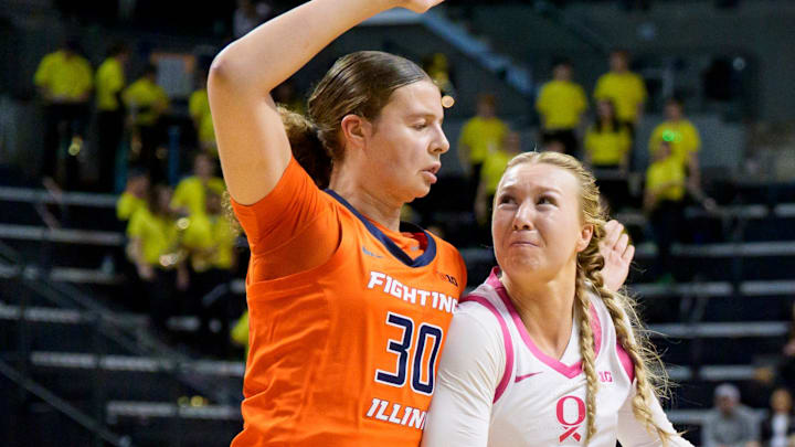 Oregon forward Mia Jacobs, right, presses past Illinois forward Cearah Parchment as the Oregon Ducks host the Illinois Fighting Illini on Feb. 4, 2026, at Matthew Knight Arena in Eugene, Oregon.